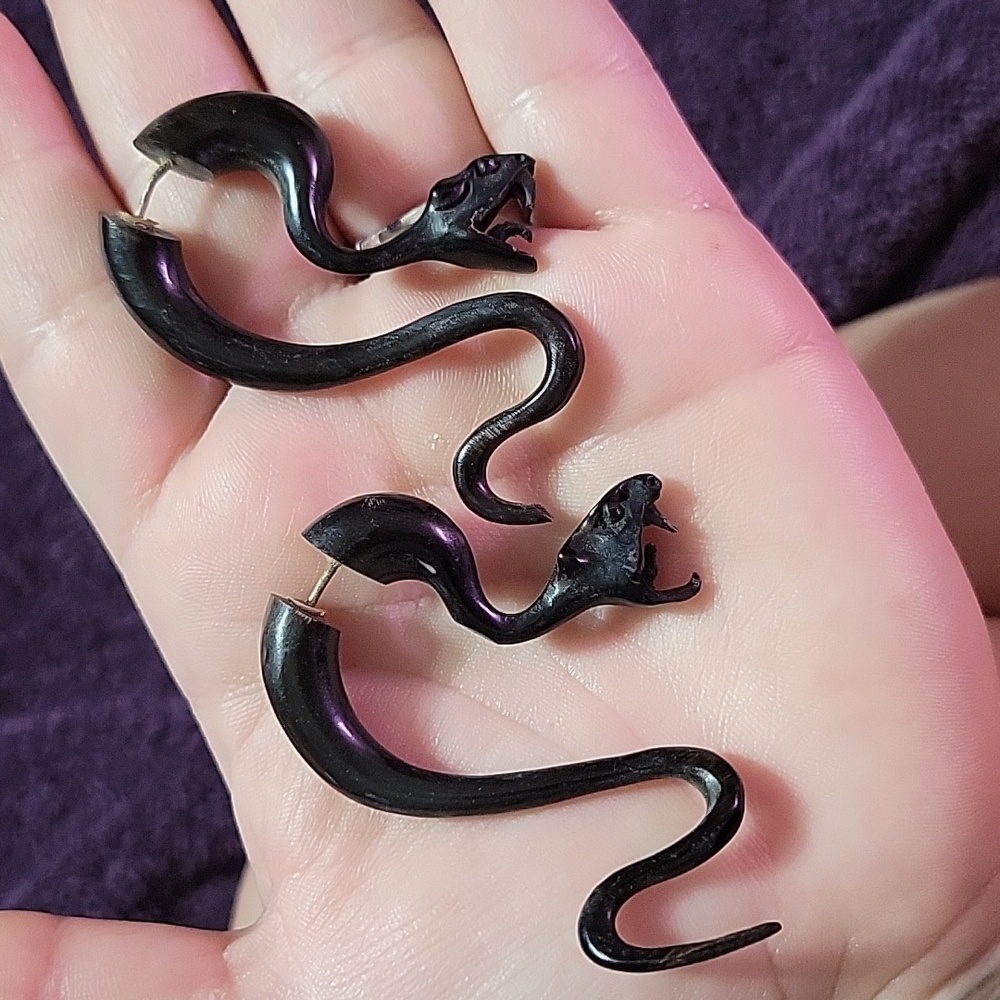 Hand carved snake earrings